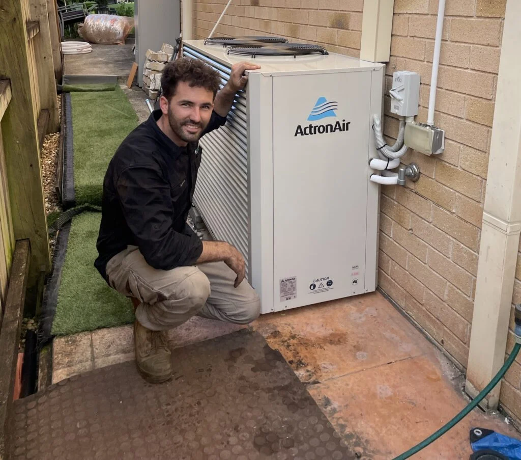 MyTradie Services technician performing AC repair and maintenance in Sydney on an ActronAir unit.